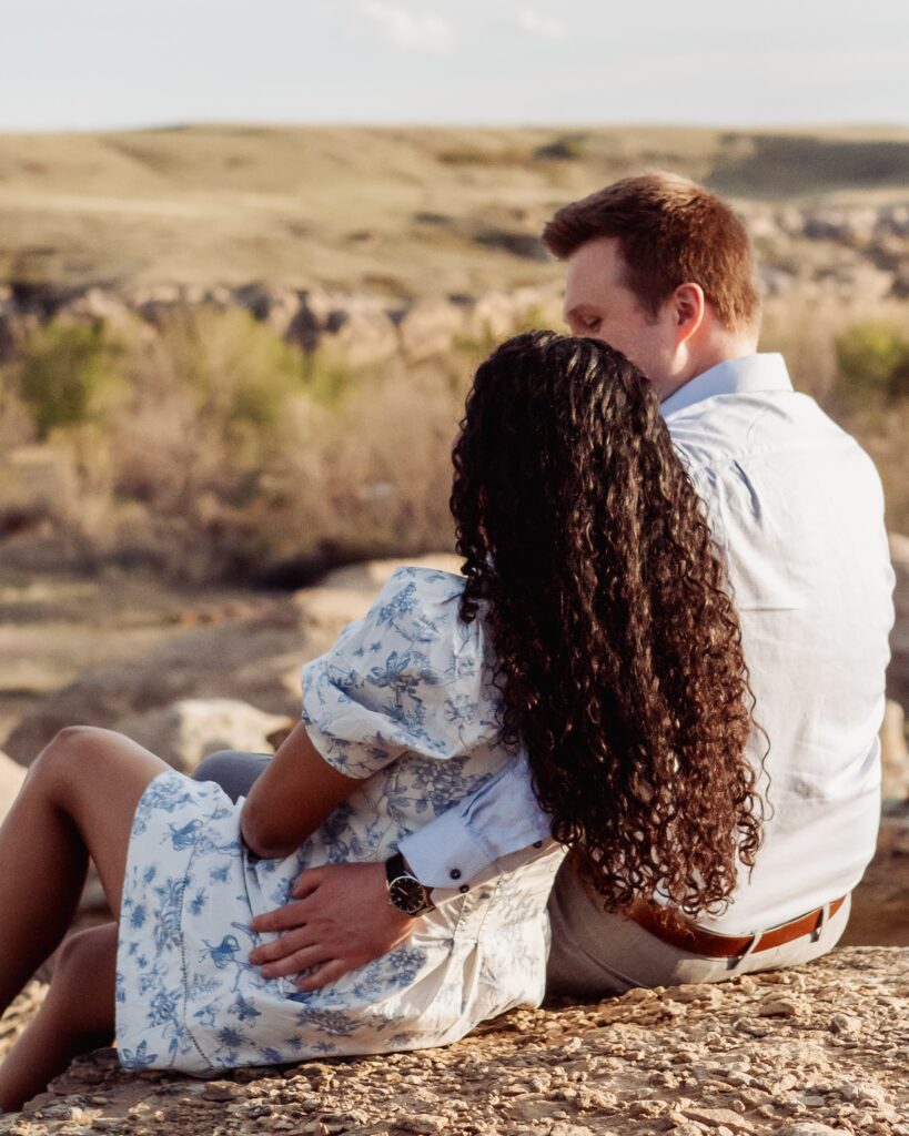 Couple sitting and enjoying the Southern Alberta views.